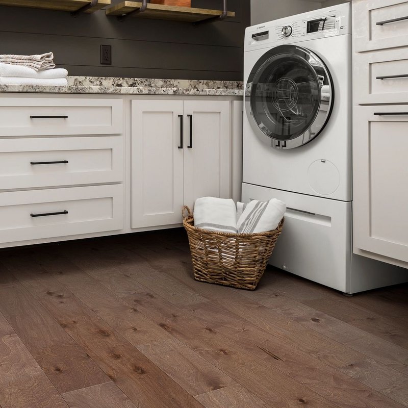 Laundry room with hardwood flooring from The Flooring Store in the Brighton, MI area